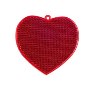Red heart-shaped hard reflector keychain made of acrylic with a microprismatic reflective surface for outdoor safety and visibility.