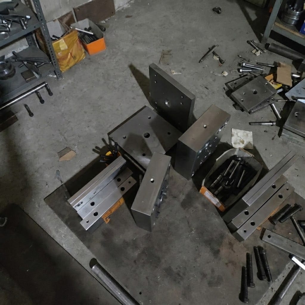 Robust industrial steel injection mold base fully assembled with guide pins and cooling system, ready for mass production.