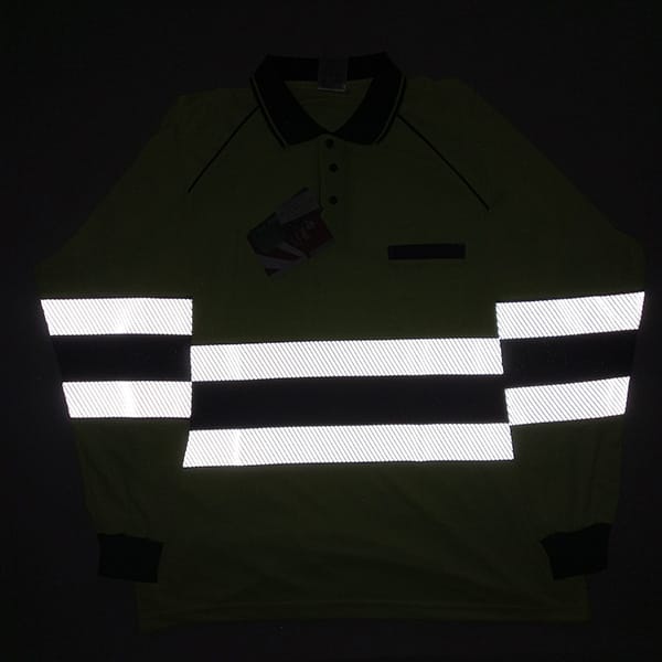 reflective workwear test showing high visibility polo shirt glowing under flash light