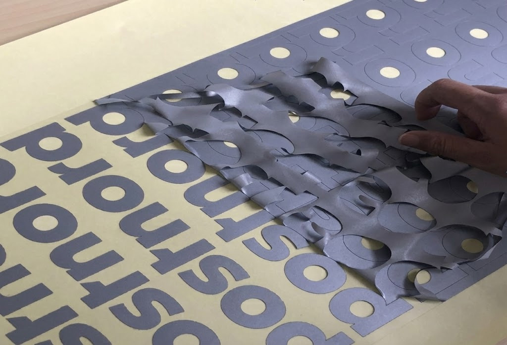 Weeding reflective heat transfer vinyl after cutting a logo design